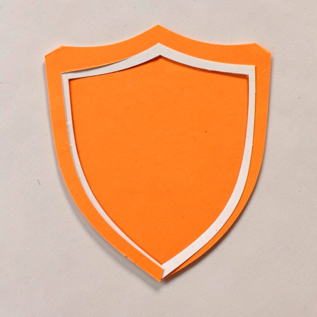 Small flat teal shield icon symbolizing leadership and responsibility